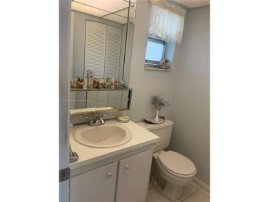 Lovely and well maintained, extended FIRST FLOOR 1/1.5 unit with on Sunrise Lakes Phase III in Florida - for sale on GolfHomes.com, golf home, golf lot
