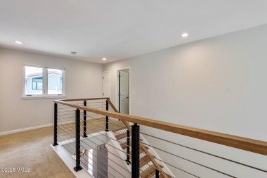This thoughtfully updated 4-bedroom, 3-bath duplex offers a on Eagle Vail Golf Course in Colorado - for sale on GolfHomes.com, golf home, golf lot