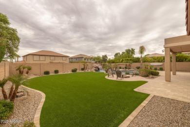 This expansive 5-bedroom, 3-bath home offers over 4,100 square on The Golf Club At Johnson Ranch in Arizona - for sale on GolfHomes.com, golf home, golf lot