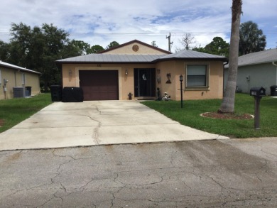 Nicely maintained concrete block home in the much sought after on Spanish Lakes I in Florida - for sale on GolfHomes.com, golf home, golf lot