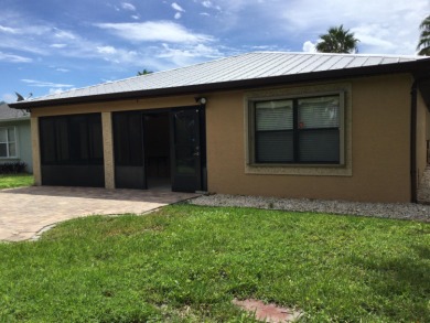Nicely maintained concrete block home in the much sought after on Spanish Lakes I in Florida - for sale on GolfHomes.com, golf home, golf lot