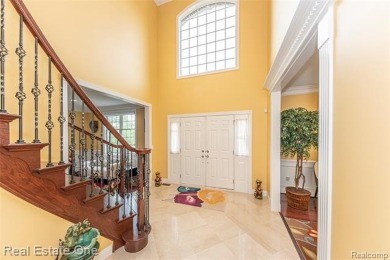 This stunning North-West facing colonial home, featuring 4 on The Inn At St. Johns Golf Course - Mark in Michigan - for sale on GolfHomes.com, golf home, golf lot