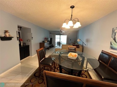 ALL AGES..E SEE IT RIGHT NOW...FIRST FLOOR END CORNER UNIT on Boca Dunes Golf and Country Club in Florida - for sale on GolfHomes.com, golf home, golf lot