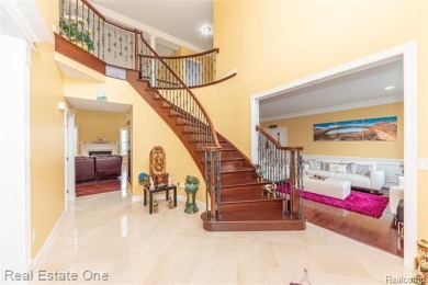 This stunning North-West facing colonial home, featuring 4 on The Inn At St. Johns Golf Course - Mark in Michigan - for sale on GolfHomes.com, golf home, golf lot