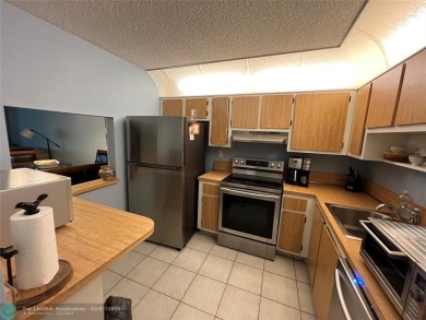 ALL AGES..E SEE IT RIGHT NOW...FIRST FLOOR END CORNER UNIT on Boca Dunes Golf and Country Club in Florida - for sale on GolfHomes.com, golf home, golf lot