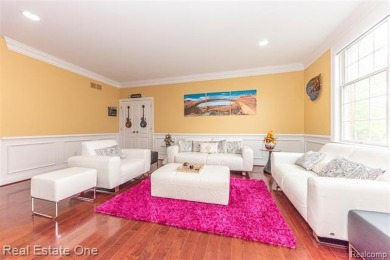 This stunning North-West facing colonial home, featuring 4 on The Inn At St. Johns Golf Course - Mark in Michigan - for sale on GolfHomes.com, golf home, golf lot