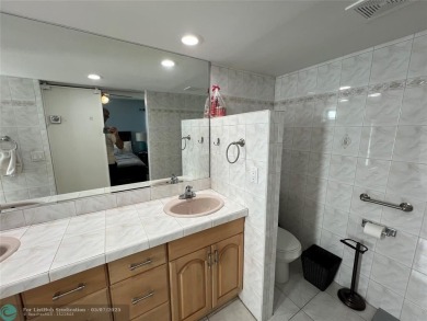 ALL AGES..E SEE IT RIGHT NOW...FIRST FLOOR END CORNER UNIT on Boca Dunes Golf and Country Club in Florida - for sale on GolfHomes.com, golf home, golf lot
