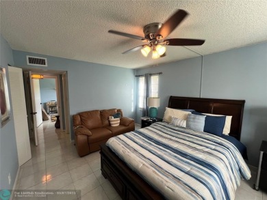 ALL AGES..E SEE IT RIGHT NOW...FIRST FLOOR END CORNER UNIT on Boca Dunes Golf and Country Club in Florida - for sale on GolfHomes.com, golf home, golf lot