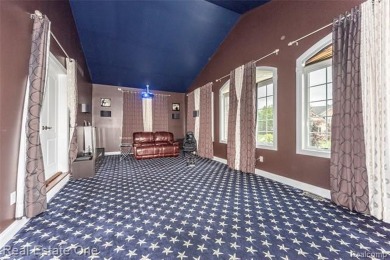 This stunning North-West facing colonial home, featuring 4 on The Inn At St. Johns Golf Course - Mark in Michigan - for sale on GolfHomes.com, golf home, golf lot