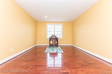 This stunning North-West facing colonial home, featuring 4 on The Inn At St. Johns Golf Course - Mark in Michigan - for sale on GolfHomes.com, golf home, golf lot