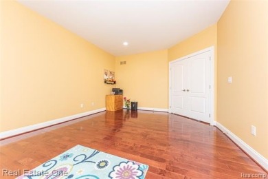 This stunning North-West facing colonial home, featuring 4 on The Inn At St. Johns Golf Course - Mark in Michigan - for sale on GolfHomes.com, golf home, golf lot