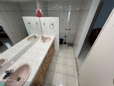 ALL AGES..E SEE IT RIGHT NOW...FIRST FLOOR END CORNER UNIT on Boca Dunes Golf and Country Club in Florida - for sale on GolfHomes.com, golf home, golf lot