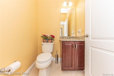 This stunning North-West facing colonial home, featuring 4 on The Inn At St. Johns Golf Course - Mark in Michigan - for sale on GolfHomes.com, golf home, golf lot