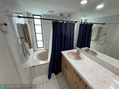 ALL AGES..E SEE IT RIGHT NOW...FIRST FLOOR END CORNER UNIT on Boca Dunes Golf and Country Club in Florida - for sale on GolfHomes.com, golf home, golf lot
