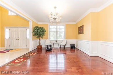 This stunning North-West facing colonial home, featuring 4 on The Inn At St. Johns Golf Course - Mark in Michigan - for sale on GolfHomes.com, golf home, golf lot