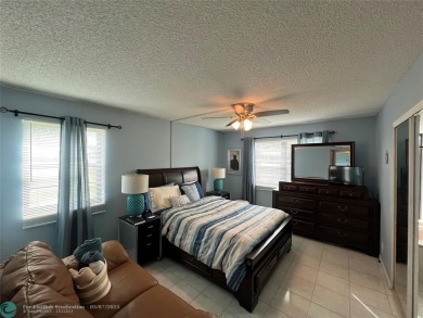 ALL AGES..E SEE IT RIGHT NOW...FIRST FLOOR END CORNER UNIT on Boca Dunes Golf and Country Club in Florida - for sale on GolfHomes.com, golf home, golf lot