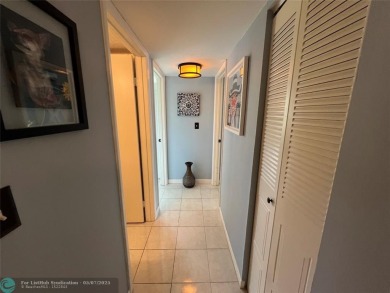 ALL AGES..E SEE IT RIGHT NOW...FIRST FLOOR END CORNER UNIT on Boca Dunes Golf and Country Club in Florida - for sale on GolfHomes.com, golf home, golf lot