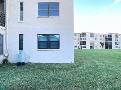 ALL AGES..E SEE IT RIGHT NOW...FIRST FLOOR END CORNER UNIT on Boca Dunes Golf and Country Club in Florida - for sale on GolfHomes.com, golf home, golf lot