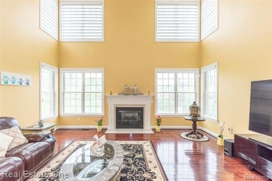 This stunning North-West facing colonial home, featuring 4 on The Inn At St. Johns Golf Course - Mark in Michigan - for sale on GolfHomes.com, golf home, golf lot