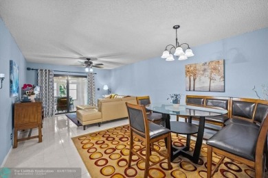 ALL AGES..E SEE IT RIGHT NOW...FIRST FLOOR END CORNER UNIT on Boca Dunes Golf and Country Club in Florida - for sale on GolfHomes.com, golf home, golf lot
