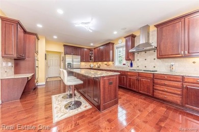 This stunning North-West facing colonial home, featuring 4 on The Inn At St. Johns Golf Course - Mark in Michigan - for sale on GolfHomes.com, golf home, golf lot