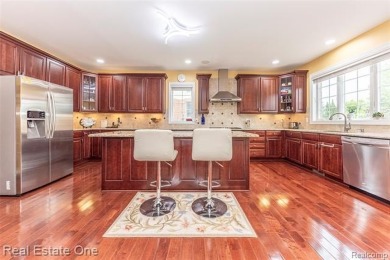 This stunning North-West facing colonial home, featuring 4 on The Inn At St. Johns Golf Course - Mark in Michigan - for sale on GolfHomes.com, golf home, golf lot