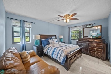 ALL AGES..E SEE IT RIGHT NOW...FIRST FLOOR END CORNER UNIT on Boca Dunes Golf and Country Club in Florida - for sale on GolfHomes.com, golf home, golf lot