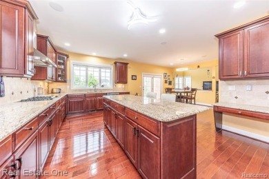 This stunning North-West facing colonial home, featuring 4 on The Inn At St. Johns Golf Course - Mark in Michigan - for sale on GolfHomes.com, golf home, golf lot