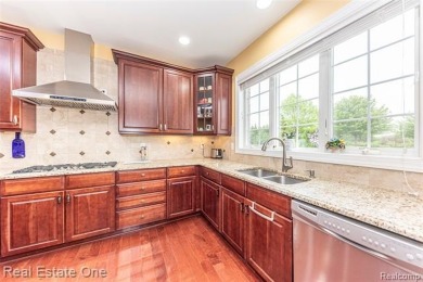 This stunning North-West facing colonial home, featuring 4 on The Inn At St. Johns Golf Course - Mark in Michigan - for sale on GolfHomes.com, golf home, golf lot