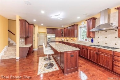 This stunning North-West facing colonial home, featuring 4 on The Inn At St. Johns Golf Course - Mark in Michigan - for sale on GolfHomes.com, golf home, golf lot