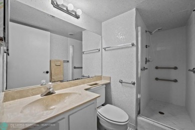 ALL AGES..E SEE IT RIGHT NOW...FIRST FLOOR END CORNER UNIT on Boca Dunes Golf and Country Club in Florida - for sale on GolfHomes.com, golf home, golf lot