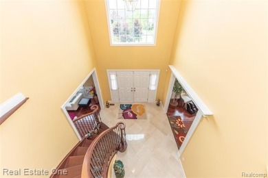 This stunning North-West facing colonial home, featuring 4 on The Inn At St. Johns Golf Course - Mark in Michigan - for sale on GolfHomes.com, golf home, golf lot