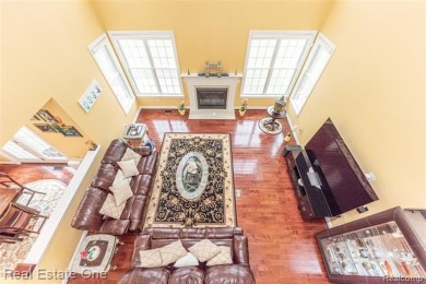 This stunning North-West facing colonial home, featuring 4 on The Inn At St. Johns Golf Course - Mark in Michigan - for sale on GolfHomes.com, golf home, golf lot