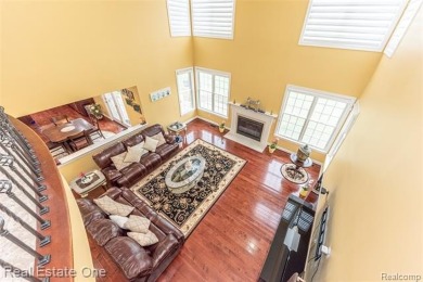 This stunning North-West facing colonial home, featuring 4 on The Inn At St. Johns Golf Course - Mark in Michigan - for sale on GolfHomes.com, golf home, golf lot