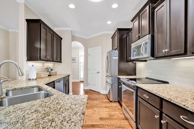 Welcome to this classic Trusst-built townhome in the sweetheart on Cape Fear National At Brunswick Forest in North Carolina - for sale on GolfHomes.com, golf home, golf lot