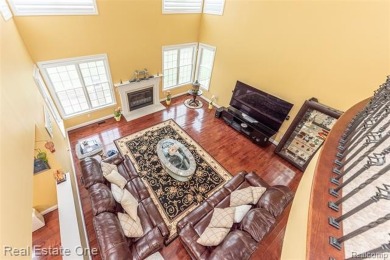 This stunning North-West facing colonial home, featuring 4 on The Inn At St. Johns Golf Course - Mark in Michigan - for sale on GolfHomes.com, golf home, golf lot