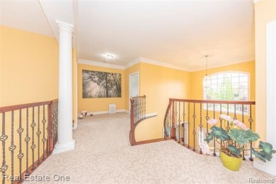 This stunning North-West facing colonial home, featuring 4 on The Inn At St. Johns Golf Course - Mark in Michigan - for sale on GolfHomes.com, golf home, golf lot