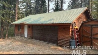 Motivated Seller! Log cabin with many improvements through the on Terrace Lakes Golf Resort in Idaho - for sale on GolfHomes.com, golf home, golf lot