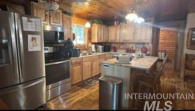 Motivated Seller! Log cabin with many improvements through the on Terrace Lakes Golf Resort in Idaho - for sale on GolfHomes.com, golf home, golf lot