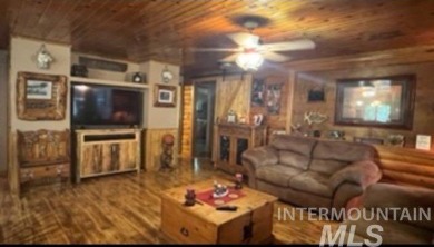 Motivated Seller! Log cabin with many improvements through the on Terrace Lakes Golf Resort in Idaho - for sale on GolfHomes.com, golf home, golf lot