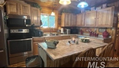 Motivated Seller! Log cabin with many improvements through the on Terrace Lakes Golf Resort in Idaho - for sale on GolfHomes.com, golf home, golf lot