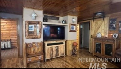 Motivated Seller! Log cabin with many improvements through the on Terrace Lakes Golf Resort in Idaho - for sale on GolfHomes.com, golf home, golf lot