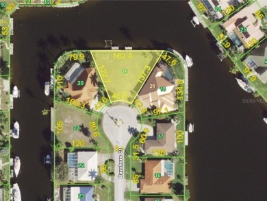 LARGER THAN AVERAGE KEY LOT IN PUNTA GORDA ISLES W/***162FT OF on Saint Andrews South Golf Club in Florida - for sale on GolfHomes.com, golf home, golf lot