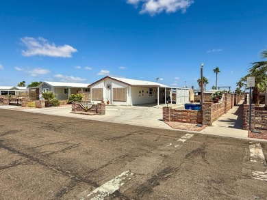 Welcome home to your charming desert retreat! This delightful on Las Barrancas Golf Course in Arizona - for sale on GolfHomes.com, golf home, golf lot