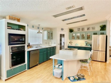 This charming residence boasts numerous delightful features. 2 on Indianwood Golf and Country Club in Florida - for sale on GolfHomes.com, golf home, golf lot