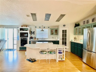 This charming residence boasts numerous delightful features. 2 on Indianwood Golf and Country Club in Florida - for sale on GolfHomes.com, golf home, golf lot