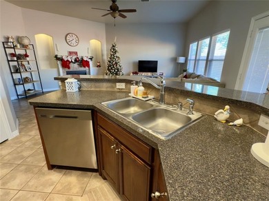 This very beautiful and well maintained 4-bedroom, 2-bath home on Eagle Mountain Country Club  in Texas - for sale on GolfHomes.com, golf home, golf lot