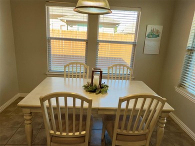 This very beautiful and well maintained 4-bedroom, 2-bath home on Eagle Mountain Country Club  in Texas - for sale on GolfHomes.com, golf home, golf lot