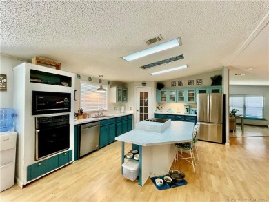 This charming residence boasts numerous delightful features. 2 on Indianwood Golf and Country Club in Florida - for sale on GolfHomes.com, golf home, golf lot