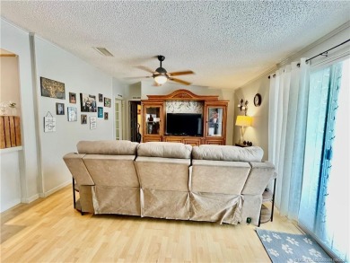 This charming residence boasts numerous delightful features. 2 on Indianwood Golf and Country Club in Florida - for sale on GolfHomes.com, golf home, golf lot